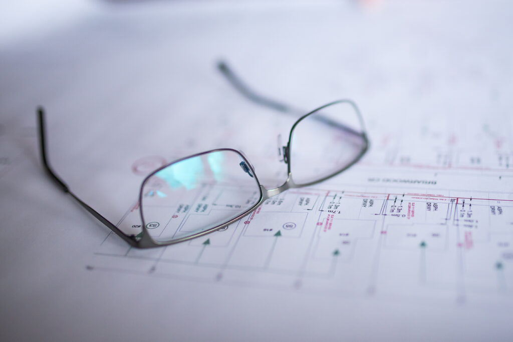 Glasses on a blue print